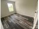 Bedroom with natural light from window and hardwood flooring throughout at 282 New Salem Rd, Statesville, NC 28625