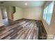 Spacious living room featuring modern luxury vinyl plank flooring and a staircase leading to the upper level at 282 New Salem Rd, Statesville, NC 28625
