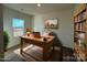 Bright home office featuring a rustic wooden desk, built-in bookcase, and a large window overlooking a serene view at 282 New Salem Rd, Statesville, NC 28625