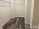 Walk-in closet features hardwood flooring and adjustable shelving for ample storage at 282 New Salem Rd, Statesville, NC 28625