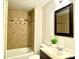 Updated bathroom with a tub, shower, and vanity at 606 Carver St, Kannapolis, NC 28083