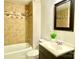 Updated bathroom with a tub, shower, and vanity at 606 Carver St, Kannapolis, NC 28083