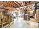 Unfinished basement with exposed pipes, brick walls, and a toilet at 2351 Hudspeth Rd, Catawba, NC 28609