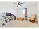 Simple bedroom with ceiling fan, window, and rocking chair at 2351 Hudspeth Rd, Catawba, NC 28609