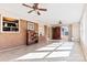 Sunroom features brick wall, built-in shelving, and ceiling fan at 2351 Hudspeth Rd, Catawba, NC 28609