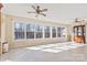 Bright sunroom with tile floors, multiple windows, and ceiling fans at 2351 Hudspeth Rd, Catawba, NC 28609