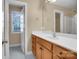 Bathroom with light wood vanity, a sink, and access to another room at 3315 Harvey Ln, Monroe, NC 28110