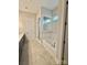 Bathroom with a soaking tub, separate shower, and tiled walls at 405 Northgate Blvd, Indian Trail, NC 28079
