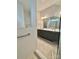 Modern bathroom featuring double sinks, granite counters, and a glass-enclosed shower at 405 Northgate Blvd, Indian Trail, NC 28079