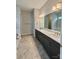 Bathroom featuring double vanity, framed mirror, modern fixtures, and tile flooring at 405 Northgate Blvd, Indian Trail, NC 28079