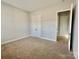 Bedroom featuring neutral paint, carpeting and walk-in closet at 405 Northgate Blvd, Indian Trail, NC 28079