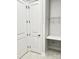 Bright closet includes shelving and a bench for ample and convenient storage inside the home at 405 Northgate Blvd, Indian Trail, NC 28079