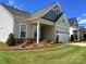 Attractive single-Gathering home with manicured lawn, stone accents, and a welcoming covered entry at 405 Northgate Blvd, Indian Trail, NC 28079