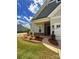 Inviting home boasts well-kept lawn, landscaping, covered entryway, and attached two-car garage at 405 Northgate Blvd, Indian Trail, NC 28079