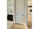 Hallway view showcasing wood floors, leading to the bathroom and kitchen at 405 Northgate Blvd, Indian Trail, NC 28079