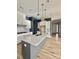 Gourmet kitchen with stainless steel appliances, a large island, pendant lights, and modern finishes at 405 Northgate Blvd, Indian Trail, NC 28079