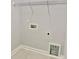 A laundry room featuring utility connections, tile floor, and wire shelving at 405 Northgate Blvd, Indian Trail, NC 28079