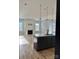 Open-concept living room with fireplace, hardwood floors, and seamlessly connected to a modern kitchen at 405 Northgate Blvd, Indian Trail, NC 28079