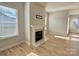 Cozy living room featuring a fireplace, beautiful wood flooring and lots of light at 405 Northgate Blvd, Indian Trail, NC 28079