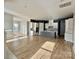 Open-concept living space with modern kitchen, island and beautiful wood flooring at 405 Northgate Blvd, Indian Trail, NC 28079