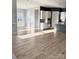 Open-concept living space with modern kitchen, island and beautiful wood flooring at 405 Northgate Blvd, Indian Trail, NC 28079