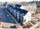Aerial view of townhomes showcasing modern design, rooftop terraces, and streetscapes at 6025 Countess Dr # 54, Charlotte, NC 28217