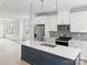 Modern kitchen featuring an island, stainless steel appliances, and white cabinetry at 6025 Countess Dr # 54, Charlotte, NC 28217