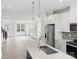 Modern kitchen featuring a large island with quartz countertops and stainless steel appliances at 6025 Countess Dr # 54, Charlotte, NC 28217