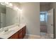 Bright bathroom features dual sinks, neutral walls, and ample counter space at 7108 Kinley Commons Ln, Charlotte, NC 28278