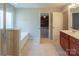 Bright bathroom featuring tile floors, a soaking tub, and a separate glass-enclosed shower at 7108 Kinley Commons Ln, Charlotte, NC 28278