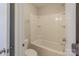 Bathroom features a white bathtub with a shower at 7108 Kinley Commons Ln, Charlotte, NC 28278