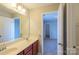 Bathroom features a double sink vanity and a door to the bedroom at 7108 Kinley Commons Ln, Charlotte, NC 28278