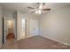 Spacious bedroom includes ceiling fan, double closet, and adjoining bathroom at 7108 Kinley Commons Ln, Charlotte, NC 28278