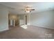 Spacious bonus room with access to the staircase, a bathroom, neutral walls and carpet at 7108 Kinley Commons Ln, Charlotte, NC 28278