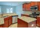 Modern kitchen featuring granite countertops, stainless steel appliances, and ample storage space at 7108 Kinley Commons Ln, Charlotte, NC 28278