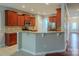 Beautiful kitchen boasts granite countertops, stainless steel appliances, and breakfast bar seating at 7108 Kinley Commons Ln, Charlotte, NC 28278
