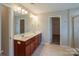 Main bathroom with double sinks, a large mirror, and vanity at 7108 Kinley Commons Ln, Charlotte, NC 28278