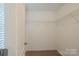 Empty walk-in closet with wire shelving and neutral carpet at 7108 Kinley Commons Ln, Charlotte, NC 28278
