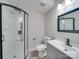 Bathroom with walk-in shower and modern vanity at 8208 Doverdale Ln, Charlotte, NC 28217