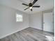 Spacious bedroom with ceiling fan and hardwood floors at 8208 Doverdale Ln, Charlotte, NC 28217