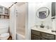 Clean bathroom with shower/tub combo and updated vanity at 11001 Carmel Crossing Rd, Charlotte, NC 28226