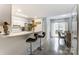 Modern kitchen with white cabinets, stainless steel appliances, and breakfast bar at 11001 Carmel Crossing Rd, Charlotte, NC 28226