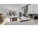 Contemporary kitchen with an island, stainless steel appliances, and access to a large outdoor deck at 13024 Moon Rd # 44, Charlotte, NC 28277