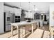 Bright kitchen featuring a large island, stainless steel appliances, and pendant lighting at 13024 Moon Rd # 44, Charlotte, NC 28277