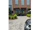 Exterior of OMB Biergarten, featuring a classic brick facade and entrance with outdoor seating visible at 13024 Moon Rd # 44, Charlotte, NC 28277
