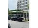 Exterior of Harriett's restaurant, featuring a modern design and outdoor seating with lush greenery on the roof at 13024 Moon Rd # 44, Charlotte, NC 28277