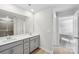 Bright bathroom featuring a double sink vanity and a shower with glass door at 1333 Morehead Dr, Salisbury, NC 28144