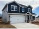 Two-story house with gray and dark gray siding, two-car garage, and landscaping at 1333 Morehead Dr, Salisbury, NC 28144