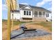Private backyard with a stone fire pit and pergola, ideal for gatherings at 267 Triple Ponds Ct # 11, Clover, SC 29710
