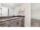 Modern bathroom featuring a large mirror, a grey vanity, and a white sink at 267 Triple Ponds Ct # 11, Clover, SC 29710